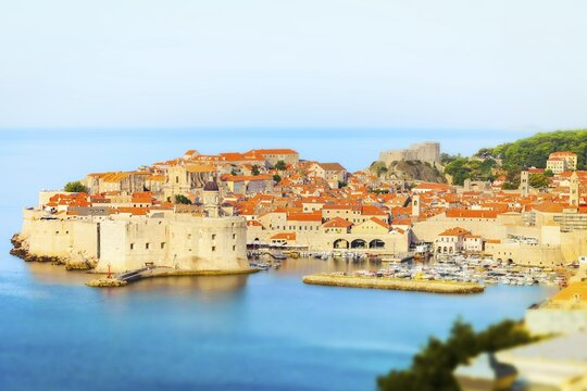 Panoramic view of Dubrovnik Old Town in Croatia with medieval stone walls, fortress, harbour and terracotta rooftops above the Adriatic Sea
