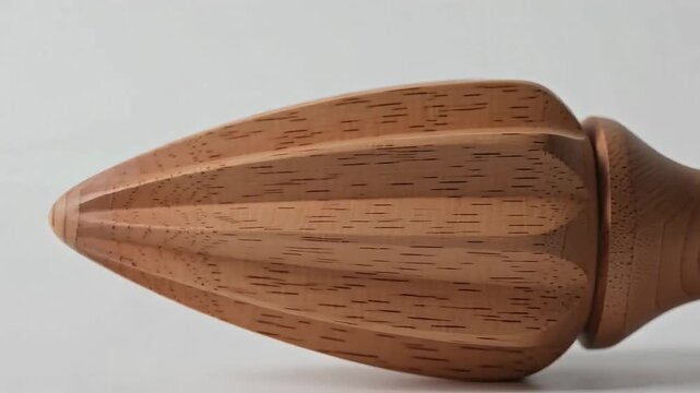 Wooden kitchen tool displayed against a dark navy blue minimalist backdrop for animation