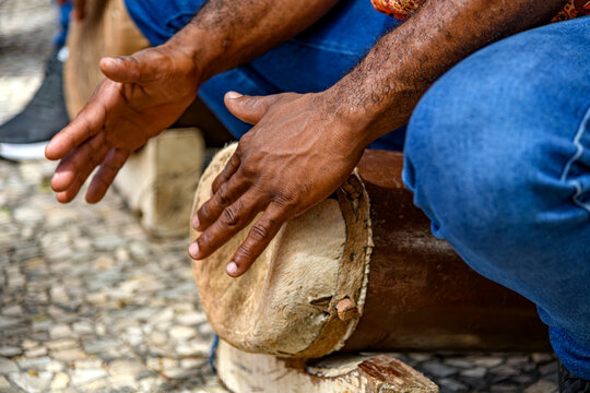 Man playing a drum typical of the *tambor de crioula* in the state of Maranhao, Brazil.