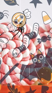 Animation of halloween icons over box of candy