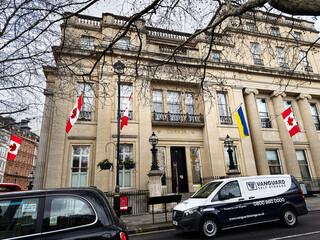 Fototapeta premium Canada High Commission building with flags at Trafalgar Square in London, UK street scene