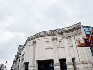 Fototapeta premium National Gallery Sainsbury Wing facade in London UK with classical architecture and cloudy sky