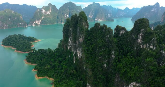 Thailand Scenic Tropical Landscape Featuring Cheow Lan Lake and Misty Karst Mountains in Khao Sok National Park