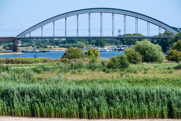 Fototapeta premium Railway arch bridge over the Lek floodplain near Culemborg.