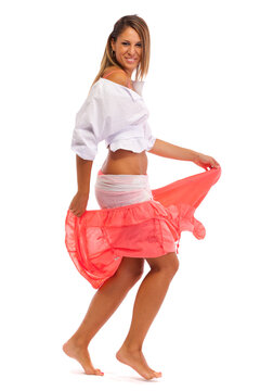 Young woman dancing. Isolated on white background