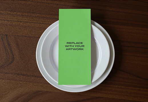 Template, Vertical brochure mockup placed on stacked white plates atop a wooden table surface for print design presentation and branding display