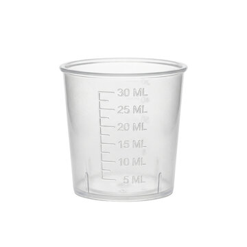 Plastic medicine measuring cup with scale on transparent background