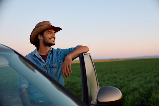 Happy farmer enjoying in view of his agricultural field.