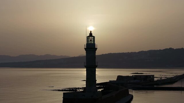  View of Chania with the amazing lighthouse, mosque, venetian shipyards, Crete, Greece.Waves crashing on lighthouse, Beautiful Greece and best scenic places - panorama