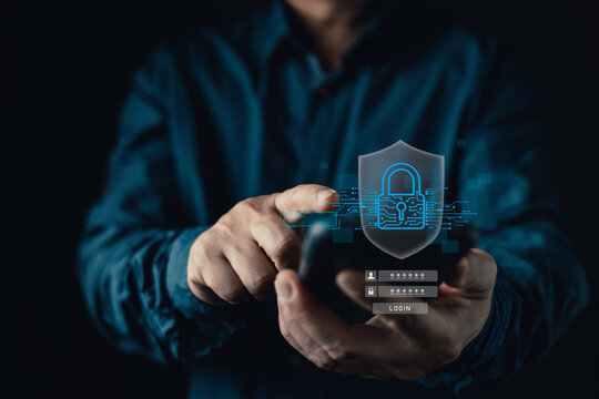 Man using smartphone with digital padlock and shield overlay. Concept of cybersecurity, data protection, secure login, privacy, and internet security. Protecting personal information.