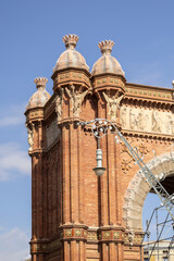 Barcelona, Catalonia, Spain, September 10 2025 Arc de Triomf Barcelona Historic Brick Arch With Sculptures, Ornate Turrets And Clear Blue Sky © © Raymond Orton