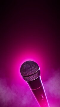 Handheld microphone under bright green stage light with drifting smoke and generous copy space. Ideal for live music, karaoke, concerts, open mic nights, performances, event promos, and entertainment.