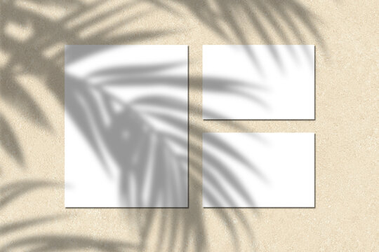 Empty white blank greeting or invitation card with wooden ball on beige background. Mock up presentation. Minimal modern style with copy space.