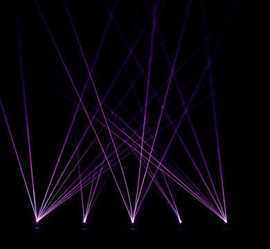 Abstract glowing purple laser light beams crossing on black background. Bright violet spotlight stage rays set. Luminous magenta laser show projection lines