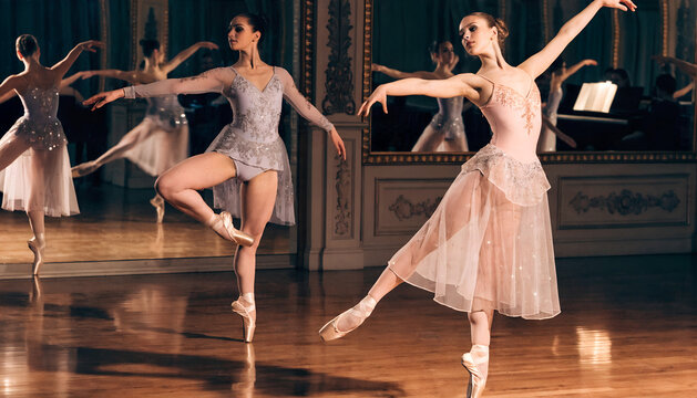 Ballet dancers practicing gracefully in ornate studio, concept of the difficulties of dance classes and training challenges, longing for a dance past after graduating from a choreographic school