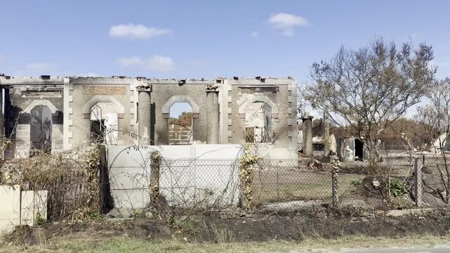 Le Porge, Gironde, France - August 2026: Roadside view of houses destroyed by wildfire along the D3, surrounded by burned vegetation and scorched trees