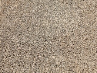 Close-up of a thatched roof background. Straw texture. © nipa