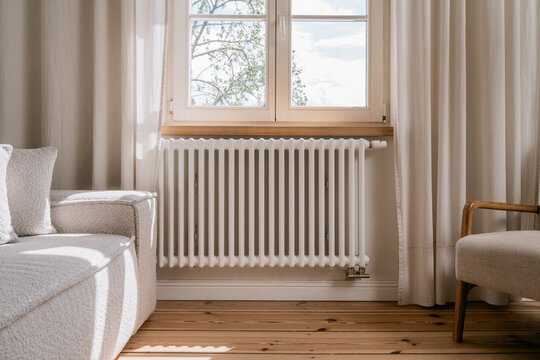 Electric radiator in living room providing warmth during cold days