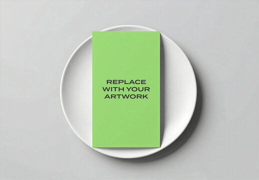 Vertical card mockup presented on a white ceramic plate, overhead view of stationery design template for branding or print presentation, display