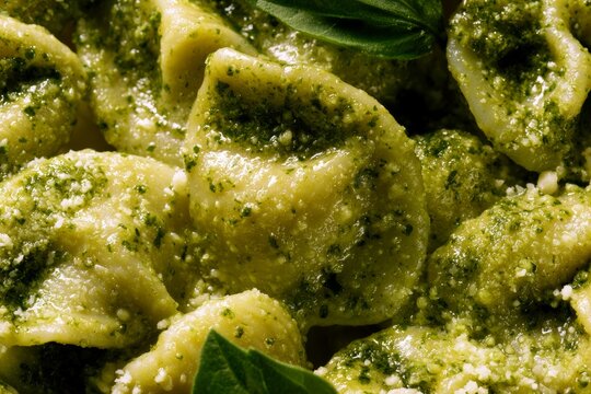 Fresh pasta with basil and pesto sauce on a plate