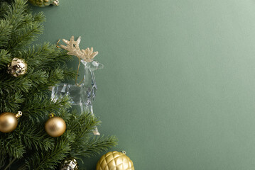 Fototapeta premium Christmas tree branch with ornaments and crystal reindeer decorative element on muted green background