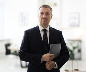 Fototapeta premium Portrait of lawyer with laptop in office