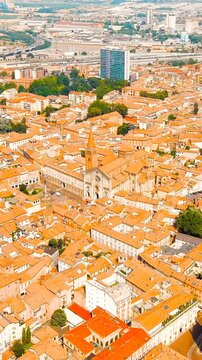 Vertical video. Piacenza, Italy. Cathedral of Piacenza. Episcopal Palace. Historical city center. Summer day. Drone footage. Rich colors