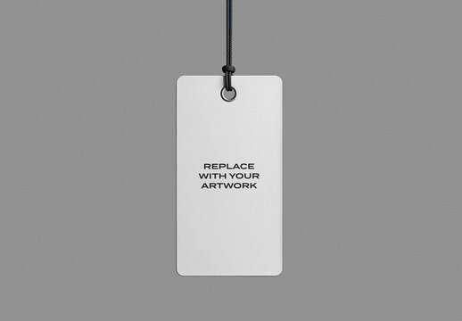 Vertical rectangular tag mockup with black cord and metal ring, blank white surface for artwork placement, minimalist presentation on neutral gray background, branding graphic design template