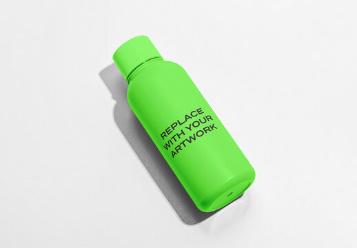 Water bottle mockup with placeholder text on a white surface, realistic product presentation for branding and graphic design, studio photography, clean commercial template
