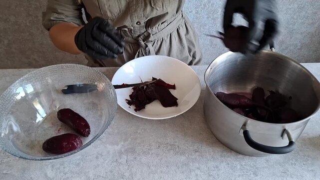 Peeling sweet potatoes for cooking in kitchen