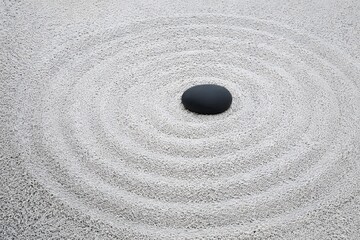 Naklejka premium Zen raked white gravel wave pattern with single smooth black river pebble