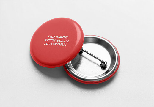 Circular pinback button mockup with back view showing metal pin mechanism, displayed on a light textured surface, Template, realistic product presentation for branding and graphic design