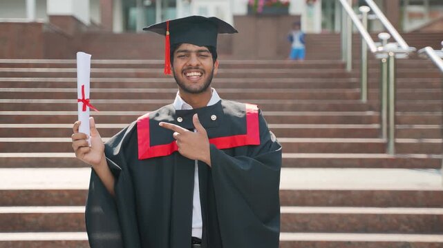 Happy indian graduate student celebrating his university degree