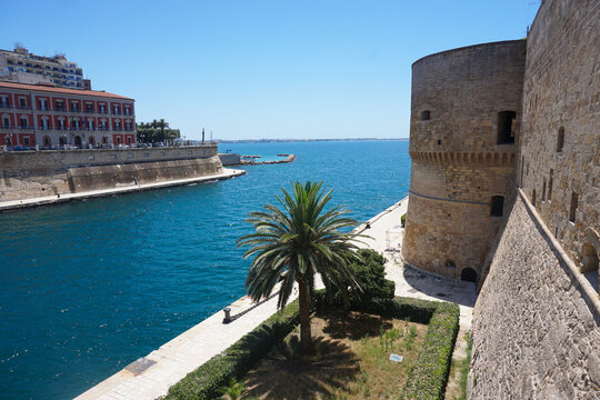 View of the Taranto Canal Boat and medieval Aragonese Castle, Apuglia Italy