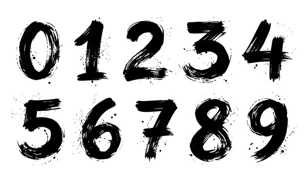 Set of handwritten numbers from zero to nine created with black ink brush strokes on white background