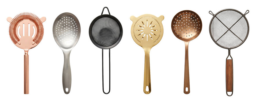 Collection of six different cocktail strainers and bar tools in various metals like copper, gold, and steel, arranged in a neat horizontal row for professional mixology