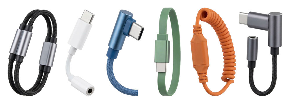 Collection of colorful USB Type-C cables and adapters in various styles including braided, coiled, flat, and right-angle connectors for modern electronic devices and gadgets