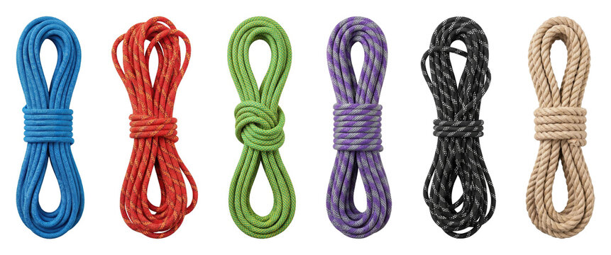 Colorful set of coiled climbing ropes in various vibrant colors and textures arranged in a neat horizontal row for mountaineering, hiking, and outdoor activities