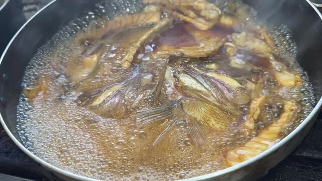 Steam and Bubbles over Fish in Sweet Soy Sauce: Japanese Sea Bream Stew (Nimono, Ara) at an Izakaya