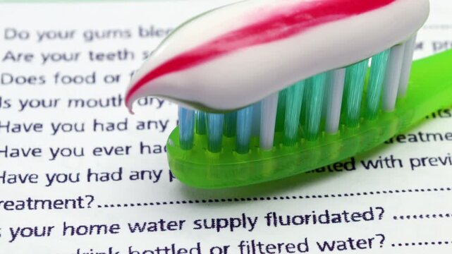 Dental Information Form with Toothbrush for Oral Health and Hygiene Concept