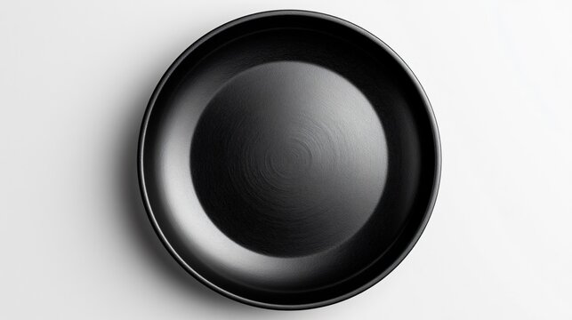 Minimalistic Black Empty Plate on White Background Top View