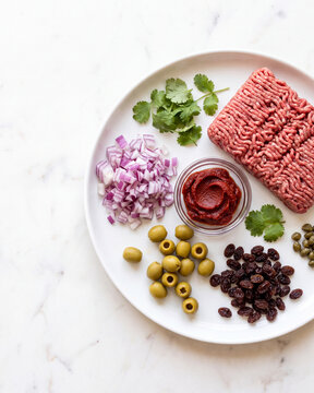 Cuban picadillo fresh ingredients flat lay, traditional beef dish components