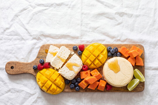 Colombian fresh cheese selection with tropical fruits, artisanal cheese board