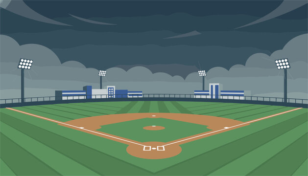 Professional baseball field illuminated by tall stadium floodlights under a dark cloudy night sky.