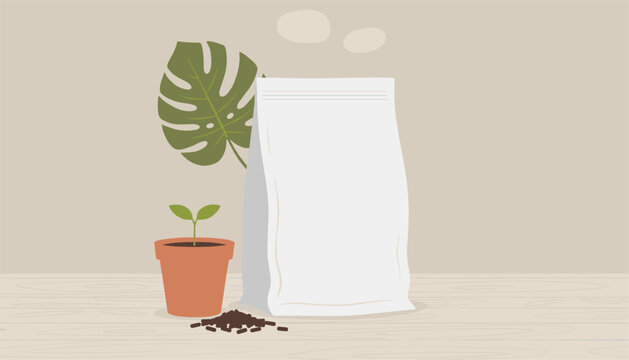 White packaging pouch on a wooden tabletop beside a terracotta pot with a young green sprout and fertilizer pellets.