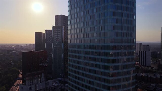 Aerial Video of Square Gardens residential skyscraper with dimmed sun during the August 2026 partial solar eclipse in Manchester UK. 