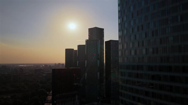 Aerial Panorama of Deansgate Square and Manchester Skyline at Partial Solar Eclipse in August 2026. 