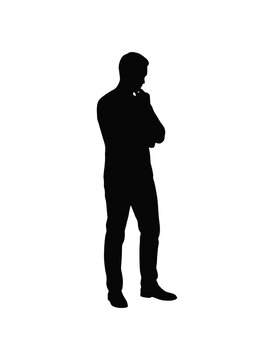 Silhouette of a man standing with arms crossed thinking silhouette standing