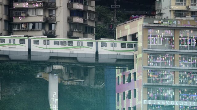 train enters liziba station inside a building on bridge in Chongqing china