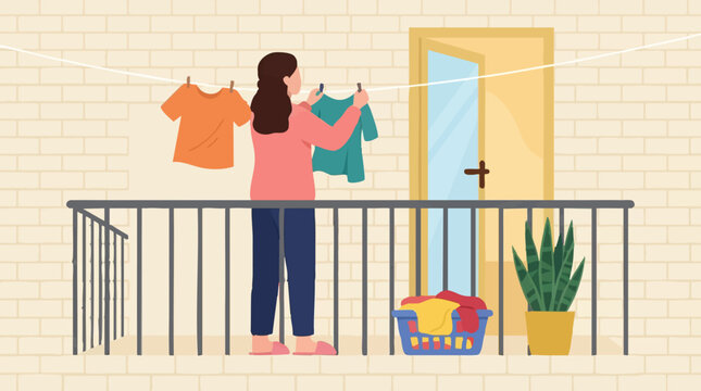 Woman hanging laundry on a clothesline on a balcony, daily routine